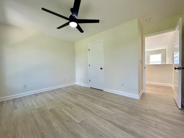 unfurnished bedroom with ceiling fan and light hardwood / wood-style flooring