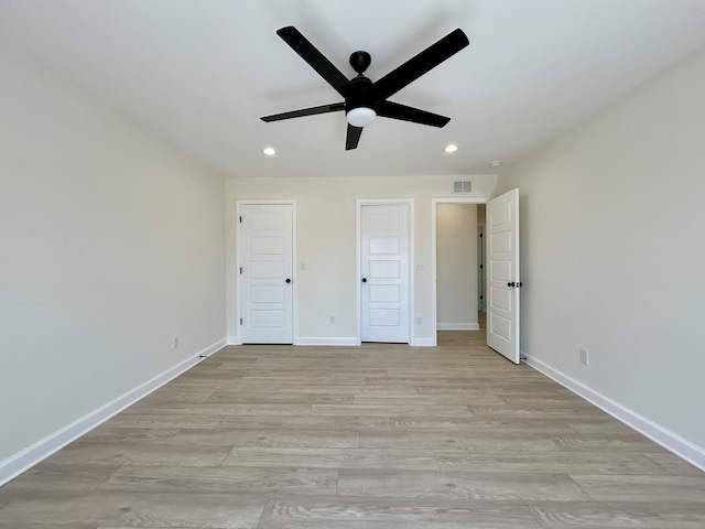 unfurnished bedroom featuring ceiling fan and light hardwood / wood-style floors