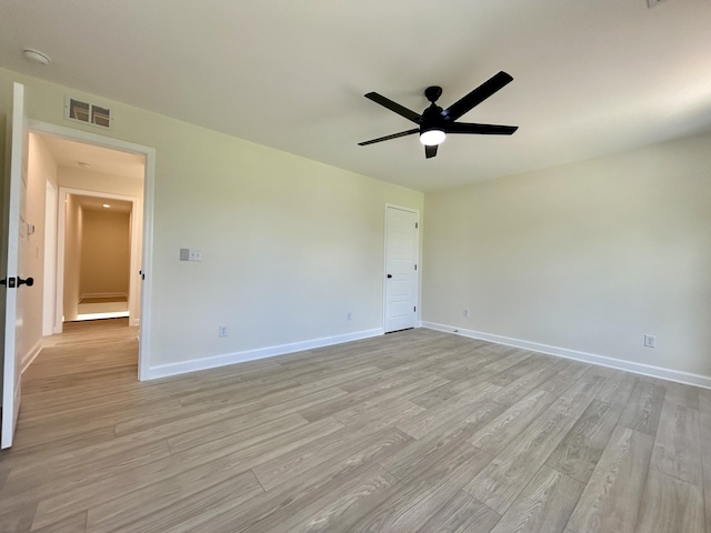 unfurnished room with ceiling fan and light hardwood / wood-style floors