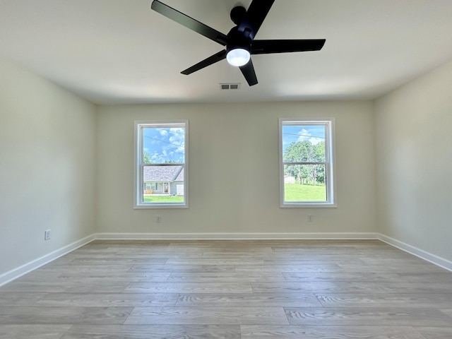 spare room with ceiling fan and light hardwood / wood-style flooring