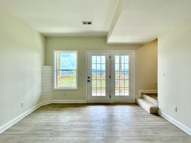 doorway to outside with light hardwood / wood-style flooring