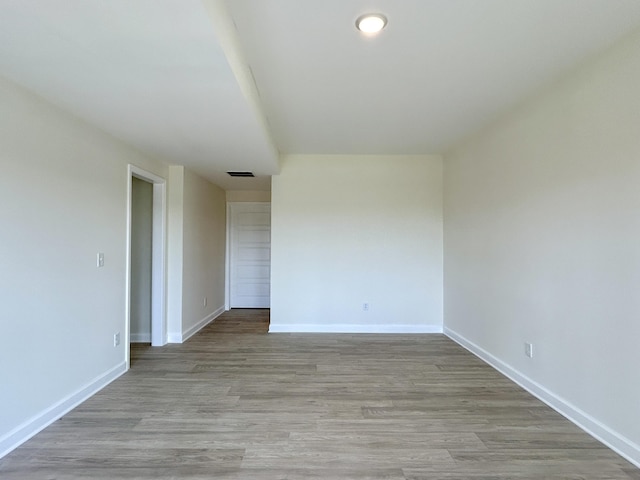 unfurnished room featuring light hardwood / wood-style floors