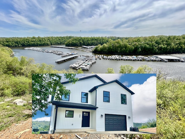 exterior space with a garage and a water view