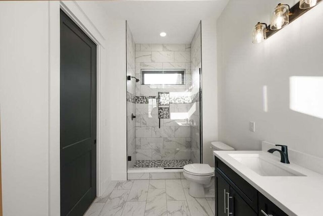 bathroom with walk in shower, vanity, and toilet