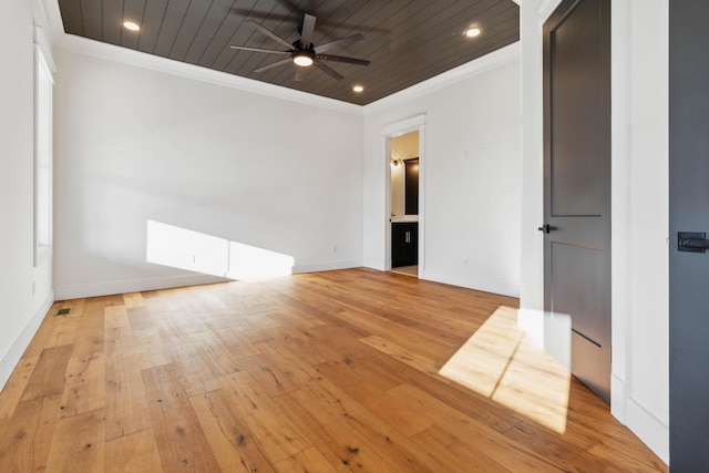 empty room with ceiling fan, light wood-type flooring, wood ceiling, and ornamental molding