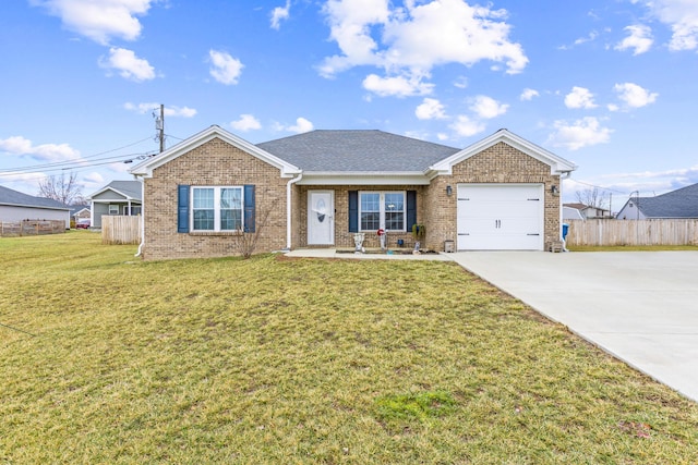 view of front of property with a garage and a front yard