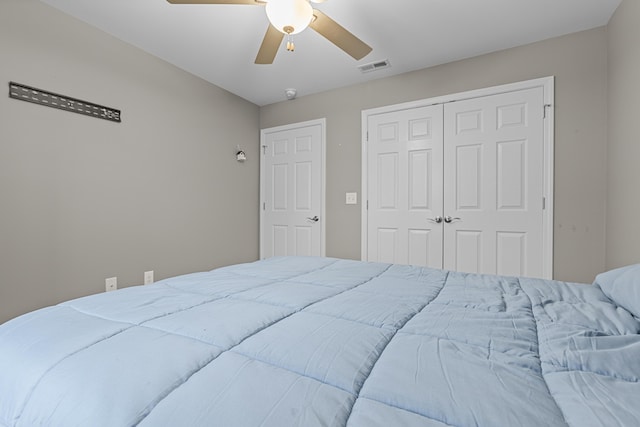 bedroom featuring ceiling fan and a closet