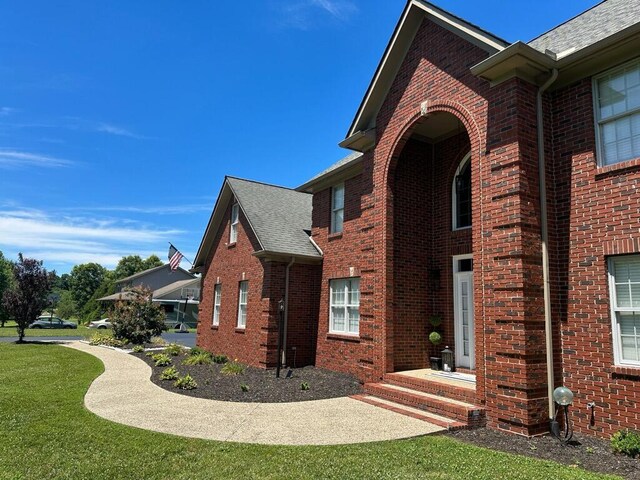 view of home's exterior featuring a yard