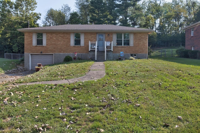 view of front of property featuring a front yard and a garage