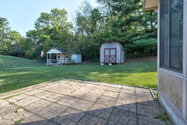 view of patio with a shed