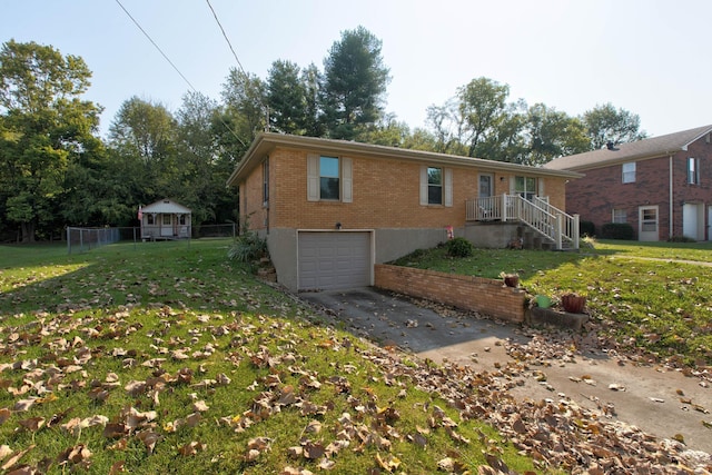 view of front of house with a front lawn and a garage