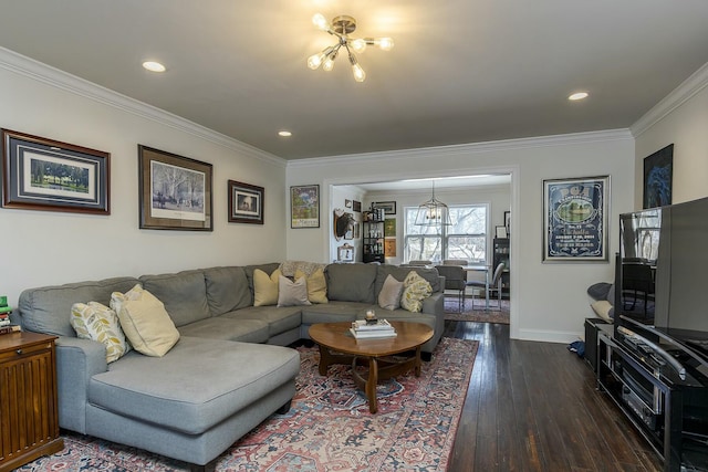 living room featuring ornamental molding, dark hardwood / wood-style flooring, and an inviting chandelier