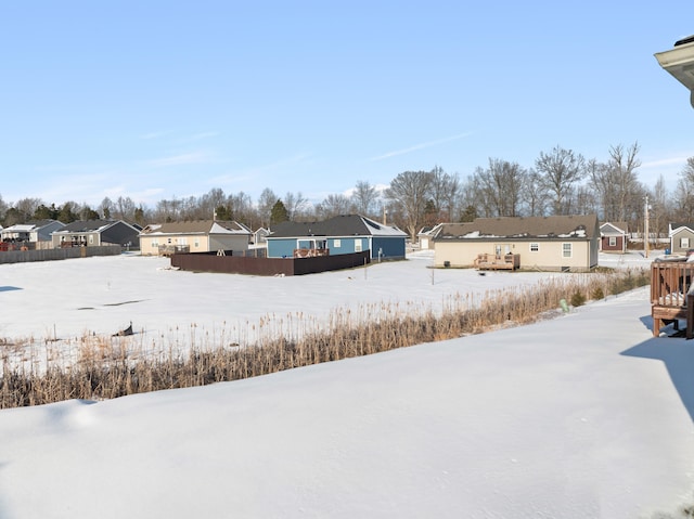 view of yard layered in snow