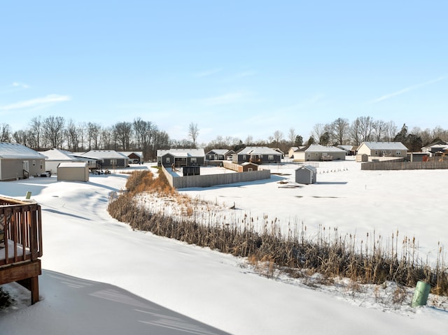 view of yard layered in snow