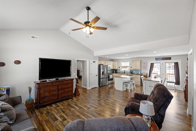 living room with french doors, ceiling fan, lofted ceiling, and dark hardwood / wood-style floors