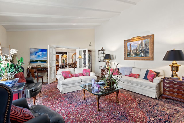 living room featuring french doors and beam ceiling