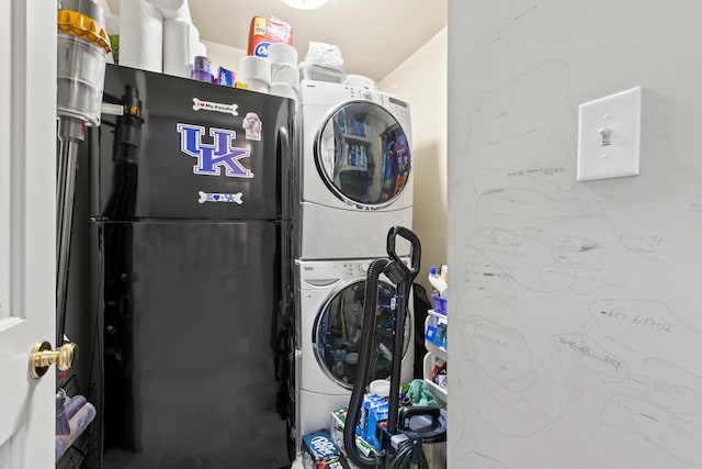 washroom featuring stacked washer / dryer