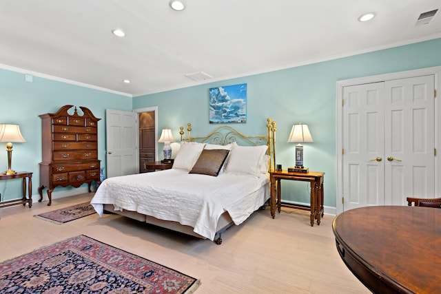 bedroom featuring ornamental molding and light wood-type flooring