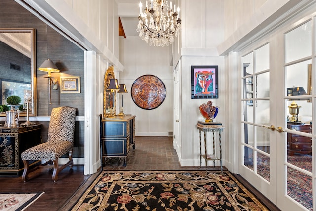 interior space featuring french doors and a notable chandelier