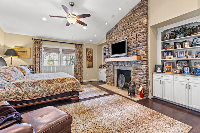 bedroom featuring lofted ceiling, dark hardwood / wood-style flooring, a fireplace, and ceiling fan