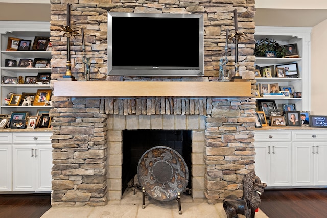 living room featuring a fireplace and dark hardwood / wood-style floors