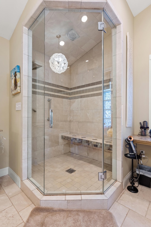 bathroom with a shower with door