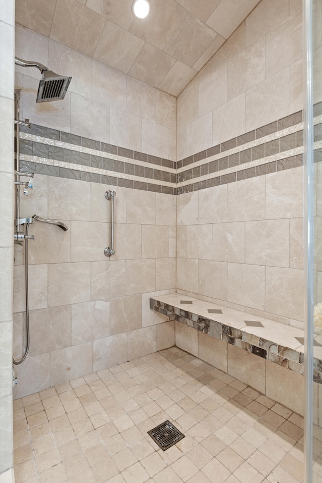 bathroom with a tile shower