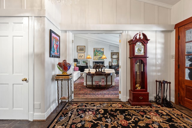 foyer featuring a fireplace and vaulted ceiling