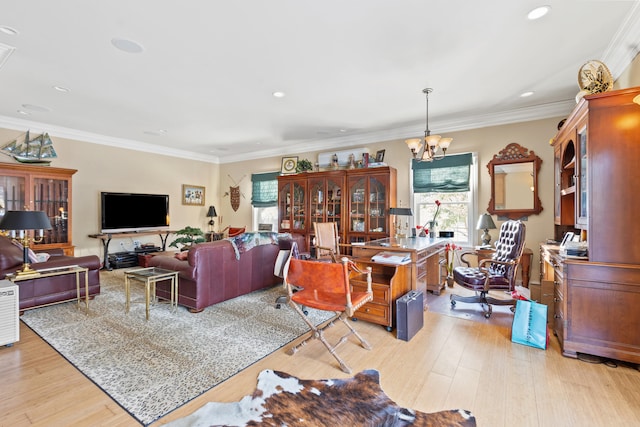 living room with an inviting chandelier, light hardwood / wood-style floors, and crown molding