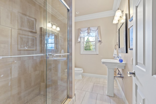 bathroom featuring toilet, a shower with door, crown molding, and tile patterned floors