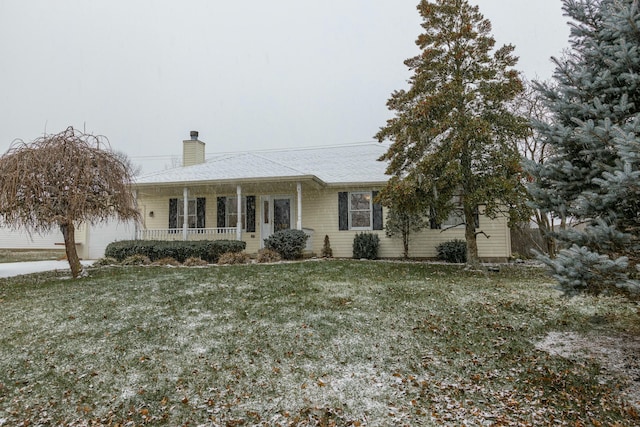 ranch-style house with a porch and a front lawn