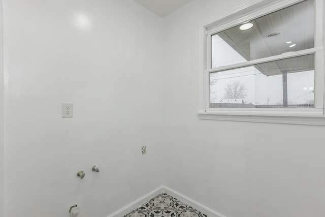 laundry room featuring tile patterned flooring