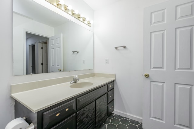 bathroom with tile patterned flooring and vanity