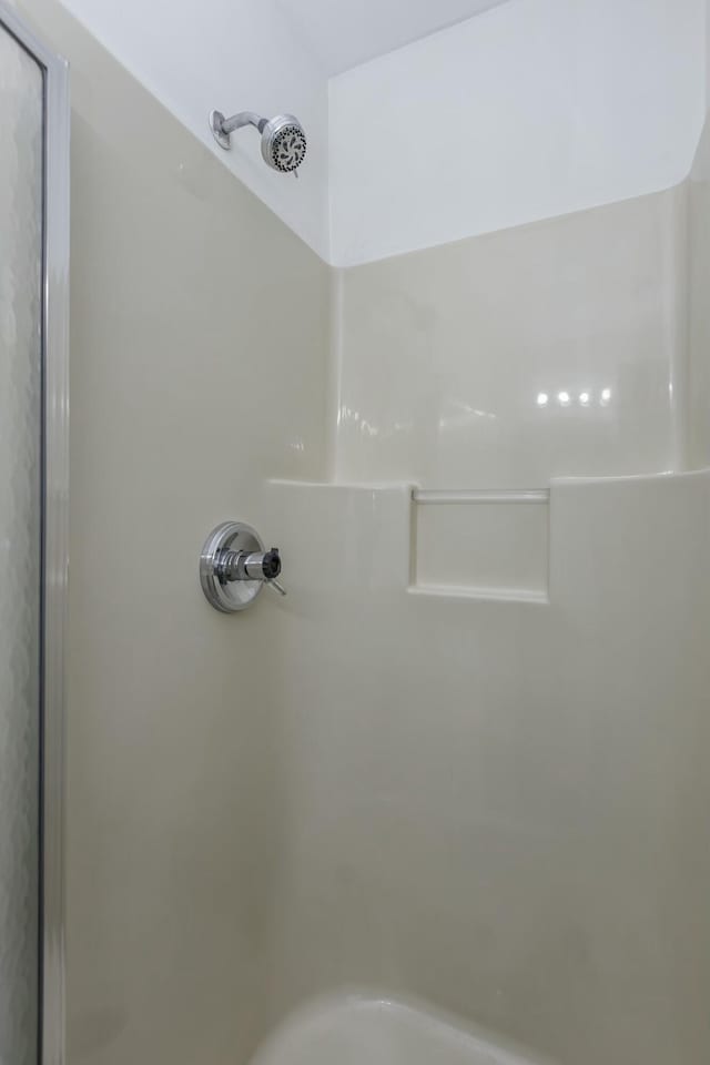 bathroom featuring walk in shower