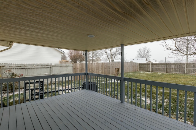 wooden deck featuring a yard