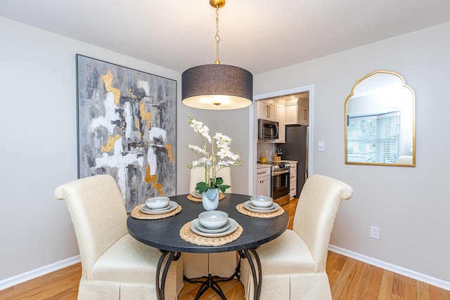 dining room featuring light wood-type flooring