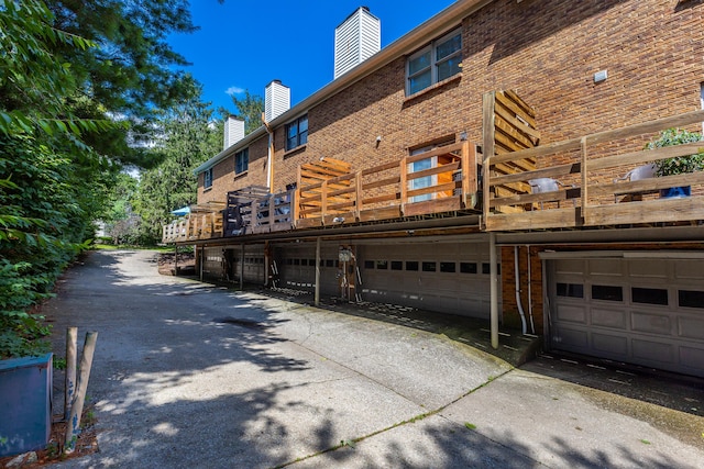 exterior space featuring a deck and a garage