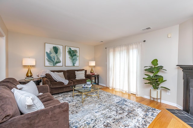 living room with light hardwood / wood-style floors