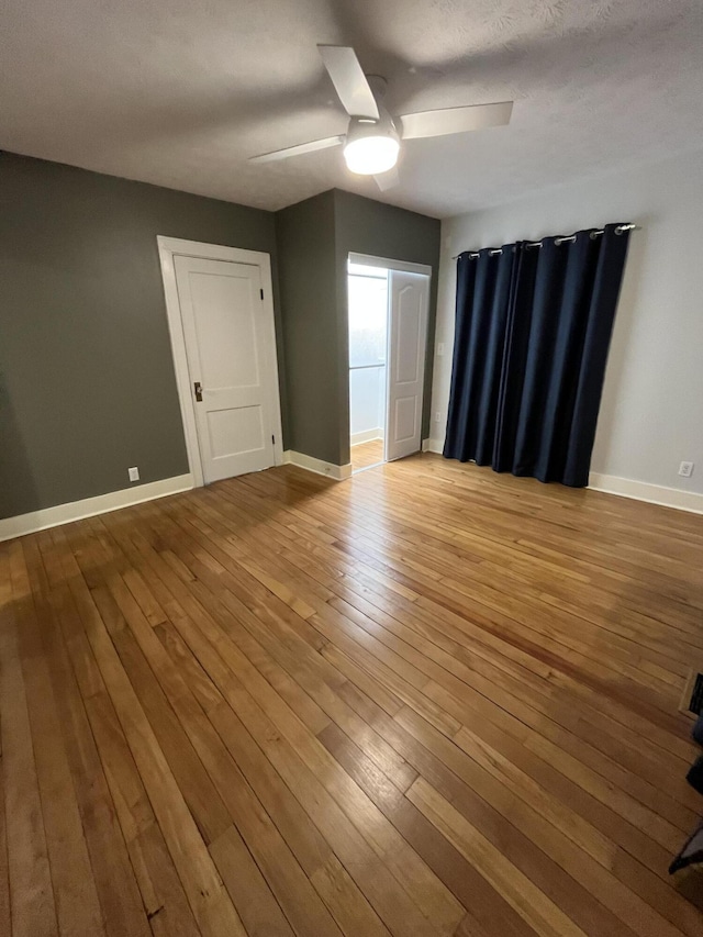 unfurnished room with light hardwood / wood-style flooring and ceiling fan