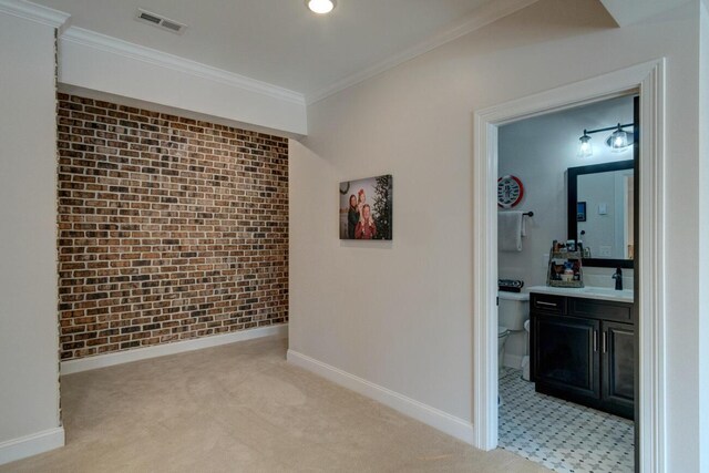 full bathroom featuring double vanity, toilet, baseboards, and a sink