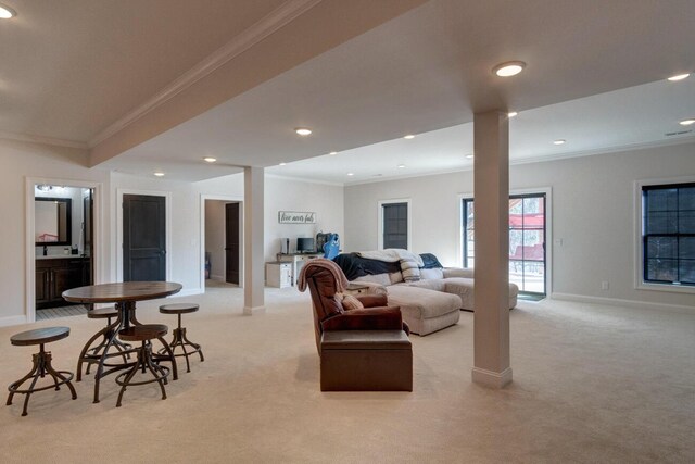 carpeted living area featuring recessed lighting, baseboards, and ornamental molding