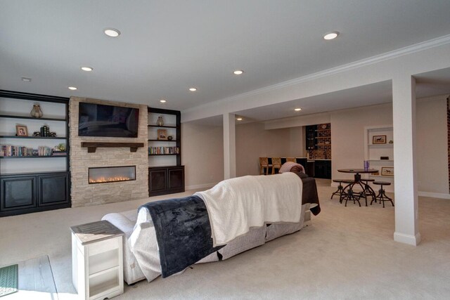 living room with light carpet, crown molding, and ornate columns