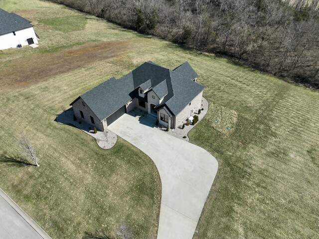 view of front facade with a front lawn and brick siding