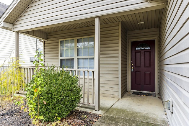 doorway to property featuring covered porch