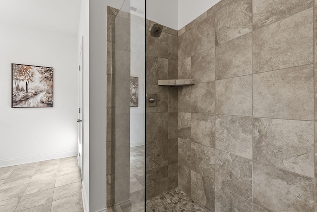 interior details with a tile shower