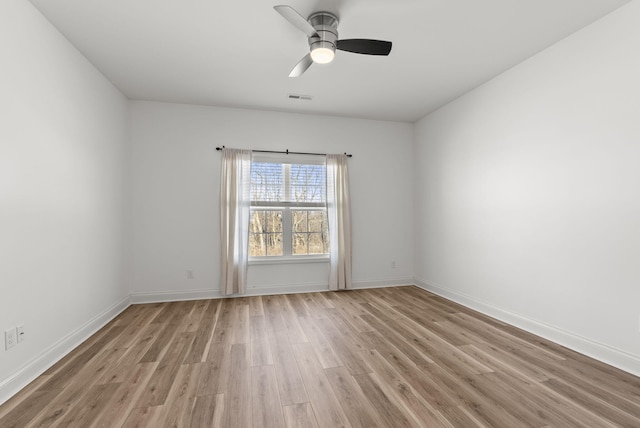 spare room with ceiling fan and light hardwood / wood-style floors