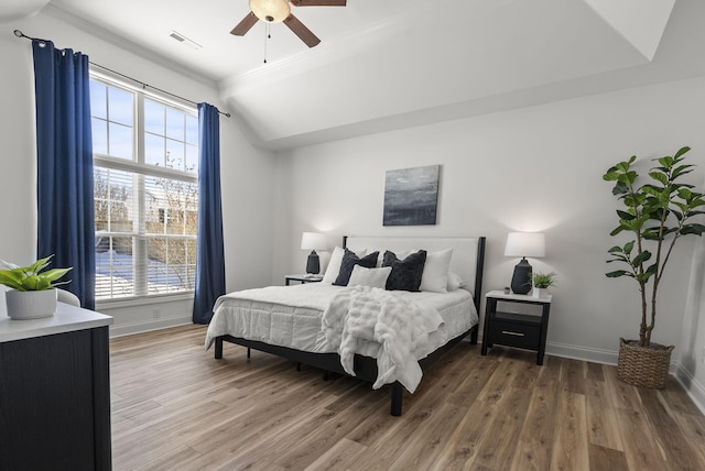 bedroom with ceiling fan and hardwood / wood-style flooring