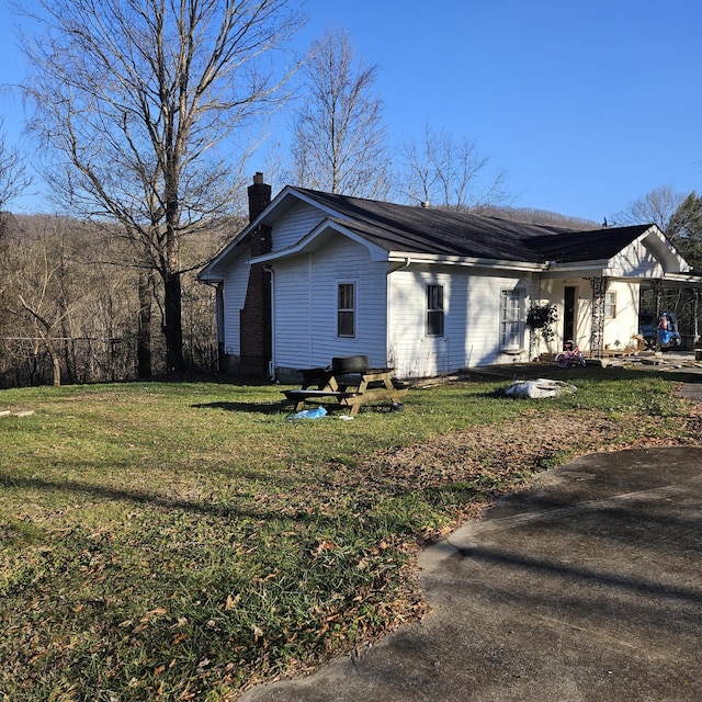 view of home's exterior featuring a yard