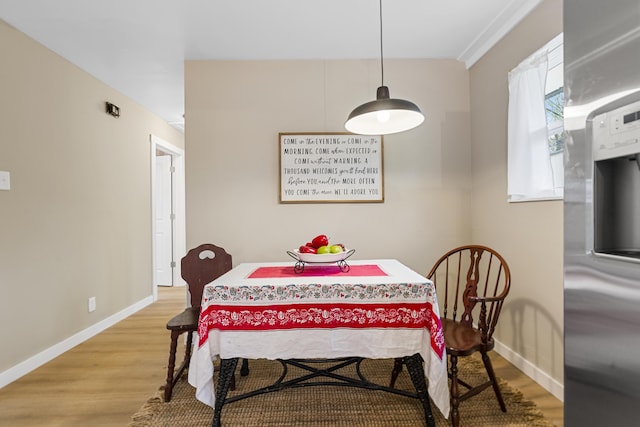 dining room with hardwood / wood-style flooring