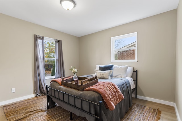 bedroom with hardwood / wood-style floors